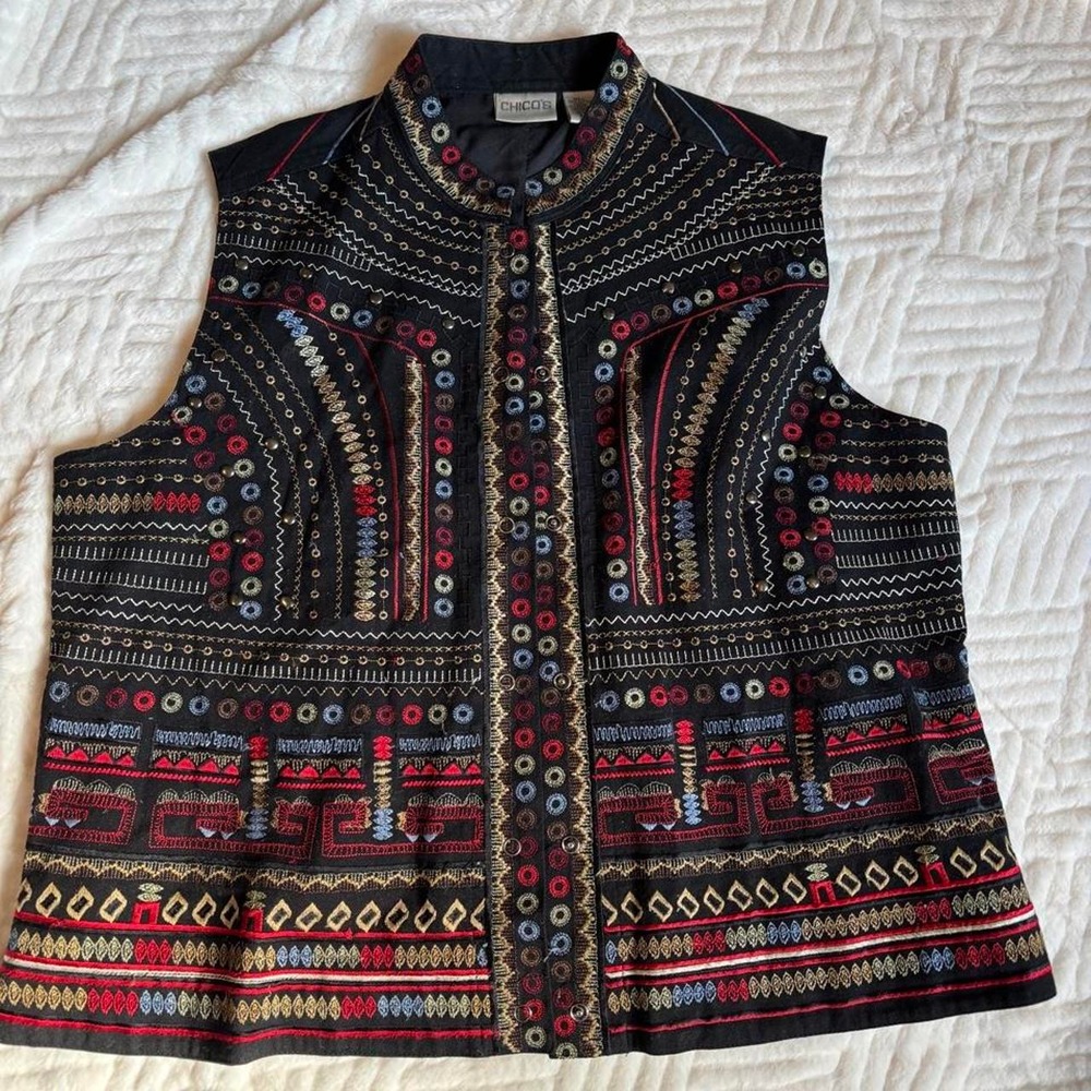Black vest with embroidery. A little of a western look.